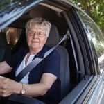 Older woman driving car